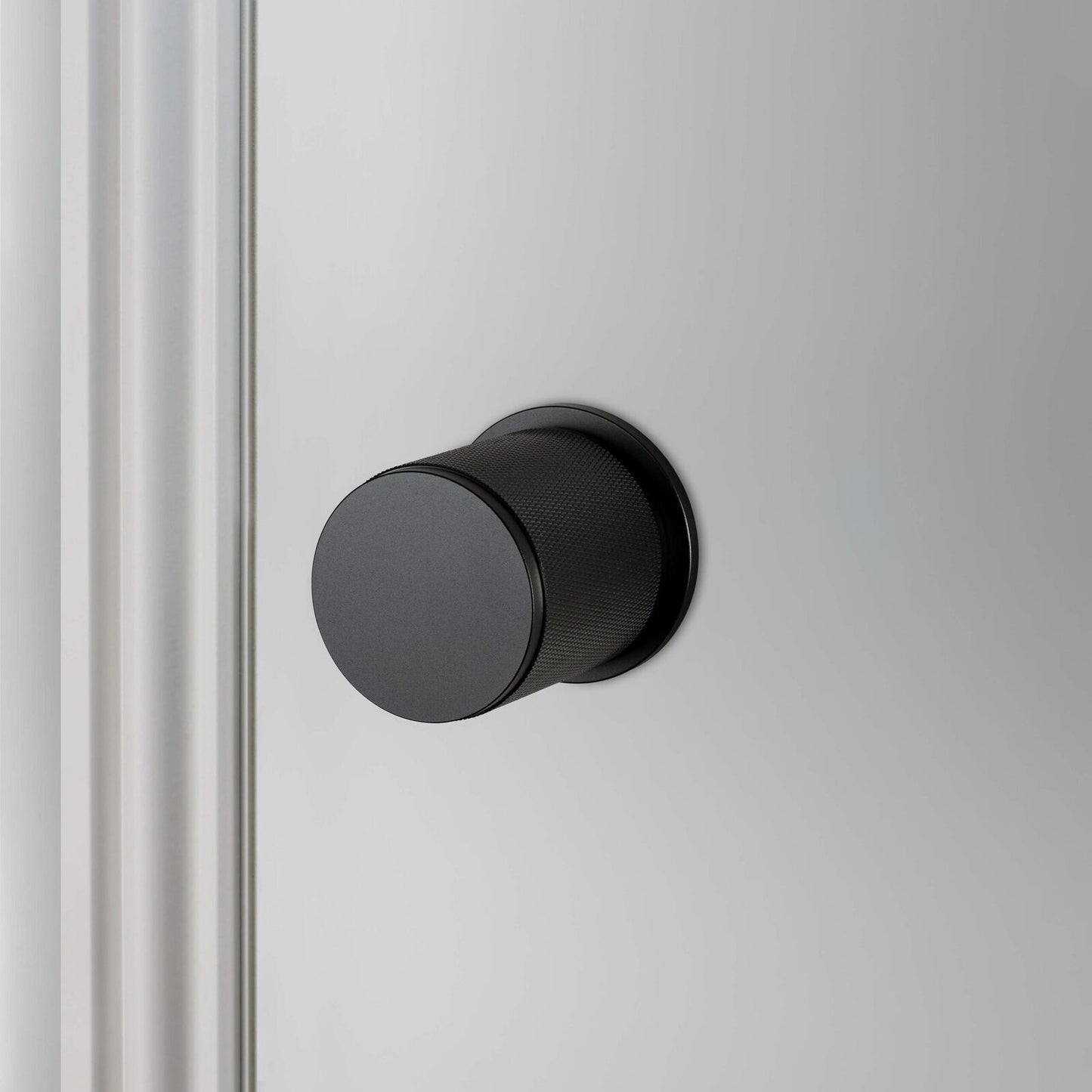 Buster and Punch Door Knob on Round Rose Cross-Knurl Pattern - Available in Various Finishes