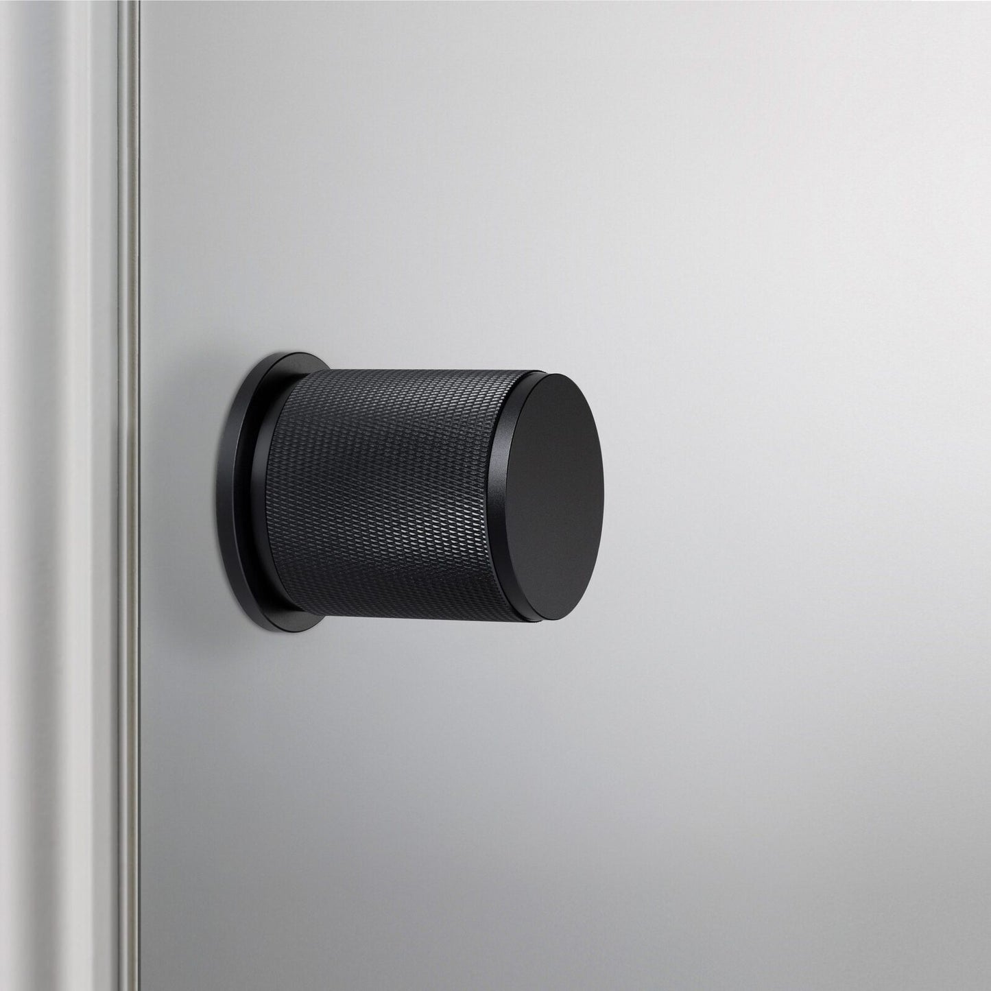 Buster and Punch Door Knob on Round Rose Cross-Knurl Pattern - Available in Various Finishes