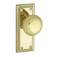 Tradco Richmond Door Knob on Short Backplate Passage Polished Brass 0980