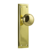 Tradco Milton Door Knob on Long Backplate Passage Unlacquered Polished Brass 21362