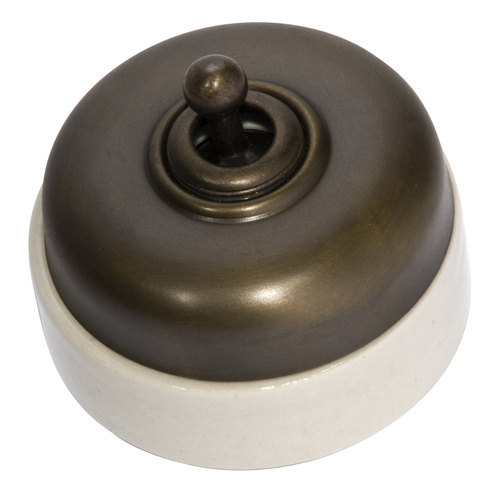Tradco 5105AB Ivory Porcelain Base Switch Antique Brass