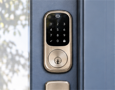 Keypad smart lock fitted to a blue front door