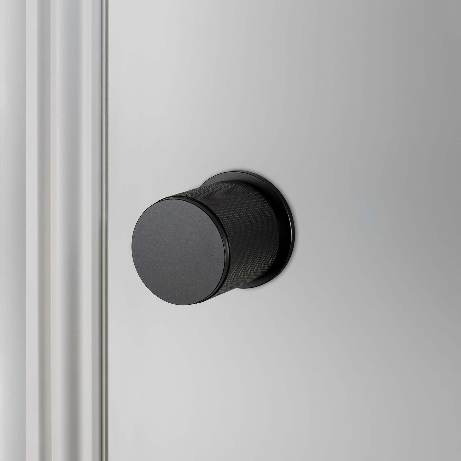 Buster and Punch Door Knob on Round Rose Cross-Knurl Pattern - Available in Various Finishes