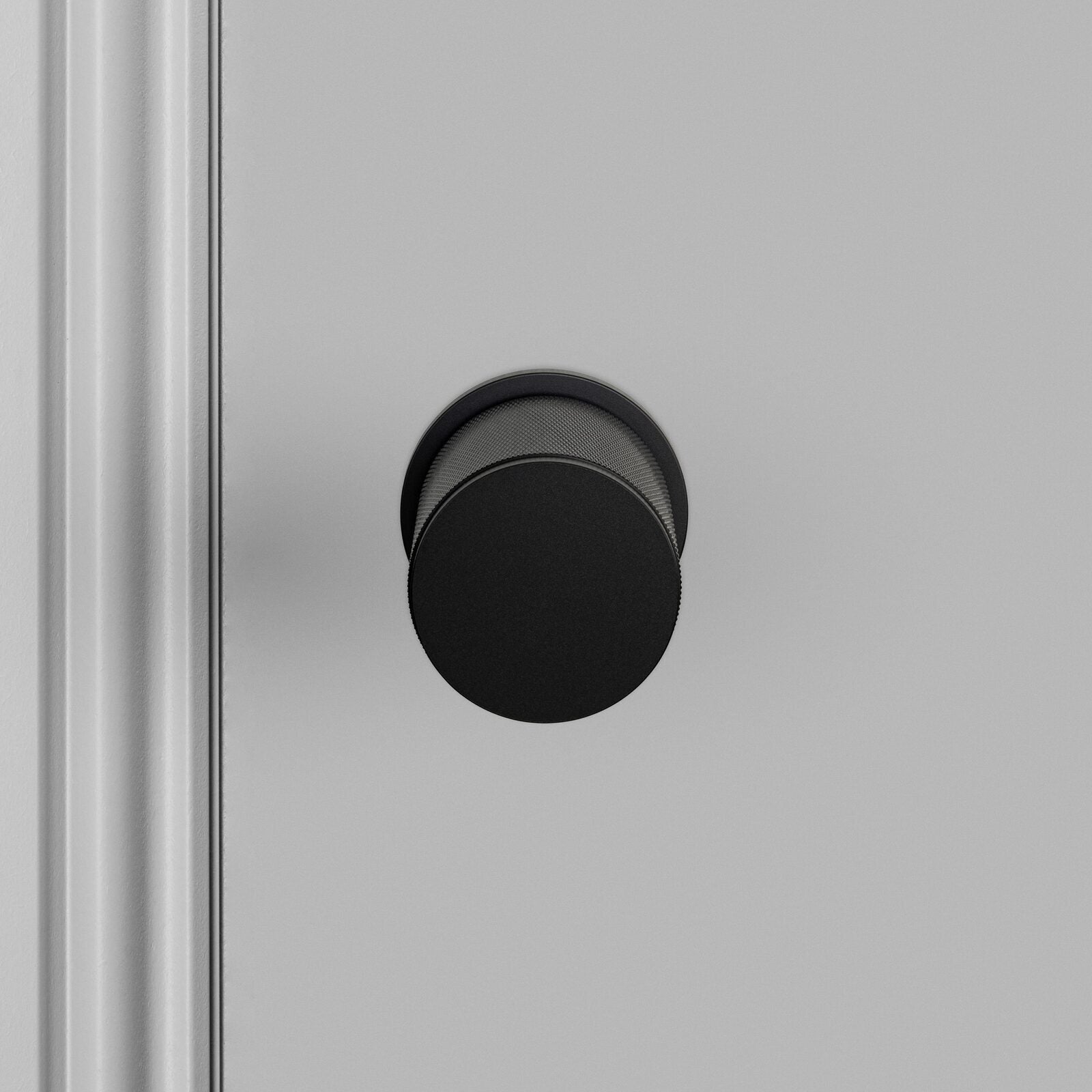 Buster and Punch Door Knob on Round Rose Cross-Knurl Pattern - Available in Various Finishes