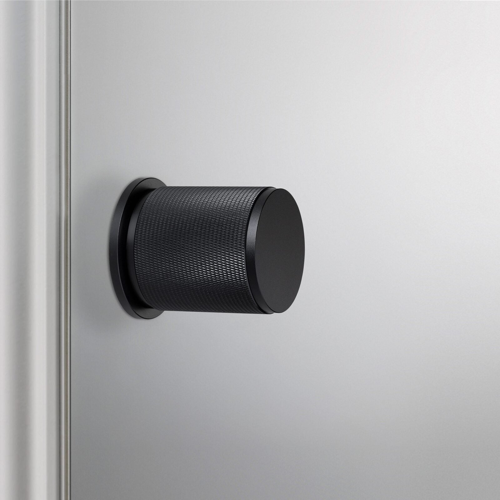 Buster and Punch Door Knob on Round Rose Cross-Knurl Pattern - Available in Various Finishes