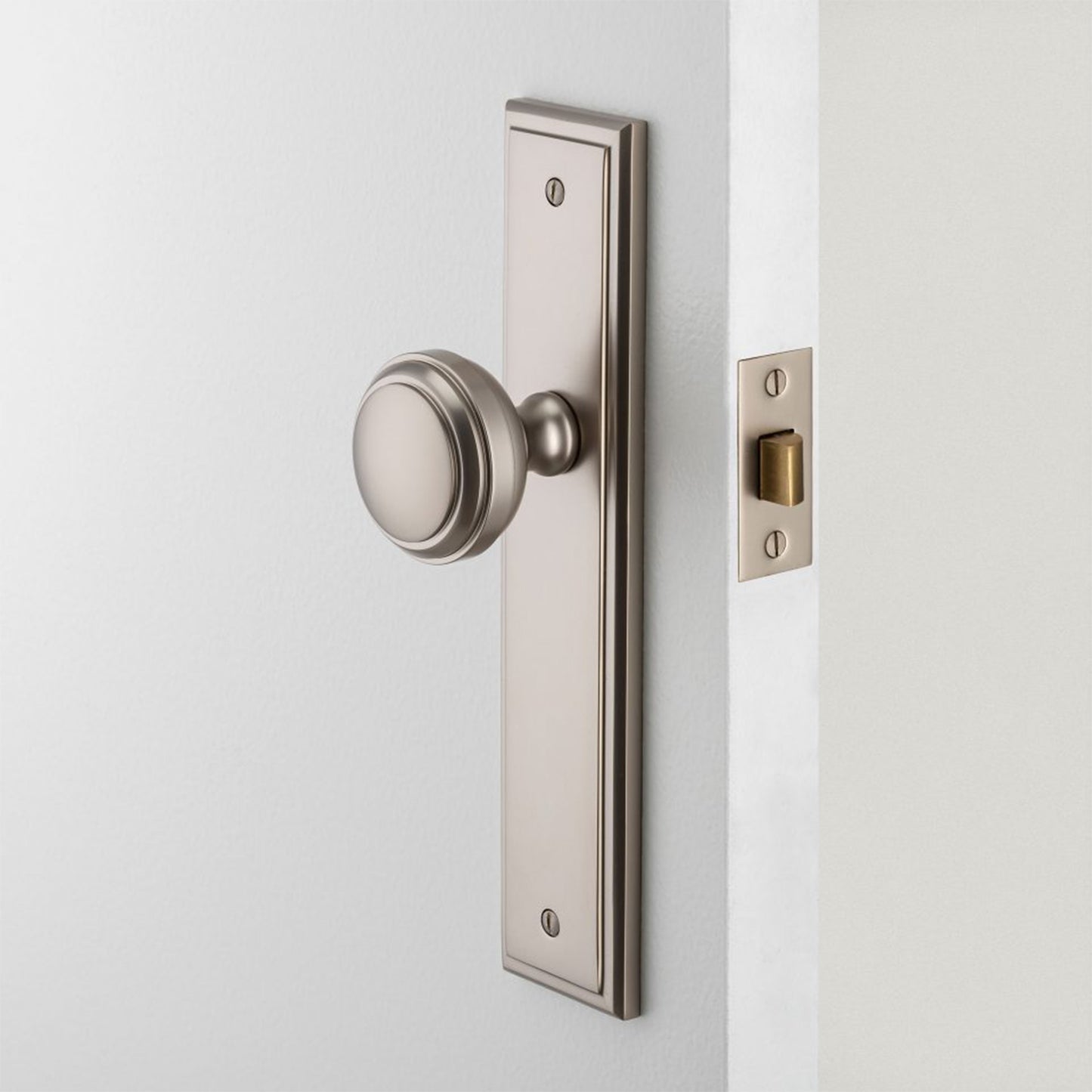 Iver Paddington Door Knob on Stepped Backplate Polished Brass